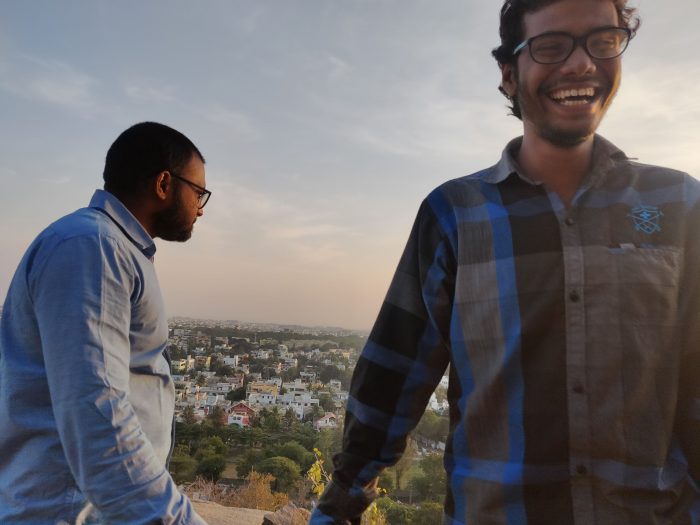 arshad looking down and amaan smiling